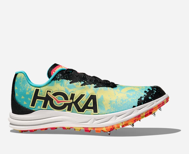 Unisex Hoka Crescendo XC shoes in cielo blue and yuzu, featuring a vibrant gradient design, black accents, and a lightweight construction with spike plate for traction.