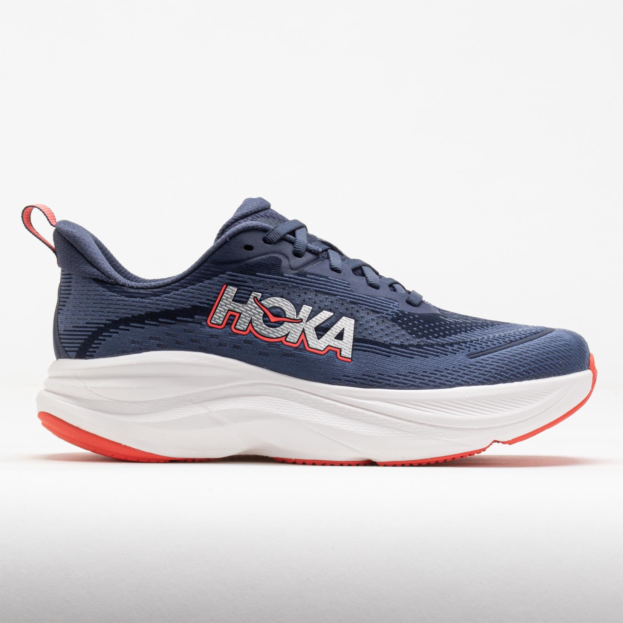 HOKA Women's Skyflow Road Running Shoes in Nautical Dusk and Anchor, featuring a breathable navy mesh upper, bold white logo, and cushioned white midsole with a red outsole.