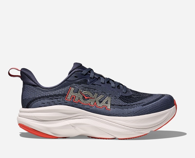 HOKA Women's Skyflow Road Running Shoes in Nautical Dusk and Anchor, featuring a breathable navy mesh upper, cushioned white midsole, and vibrant red accents. Size 9.5.