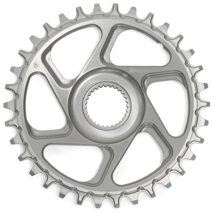 Silver 34T direct mount chainring by Hope, featuring a sleek design with cutouts and a central hole for mounting, made from durable material for enhanced performance.