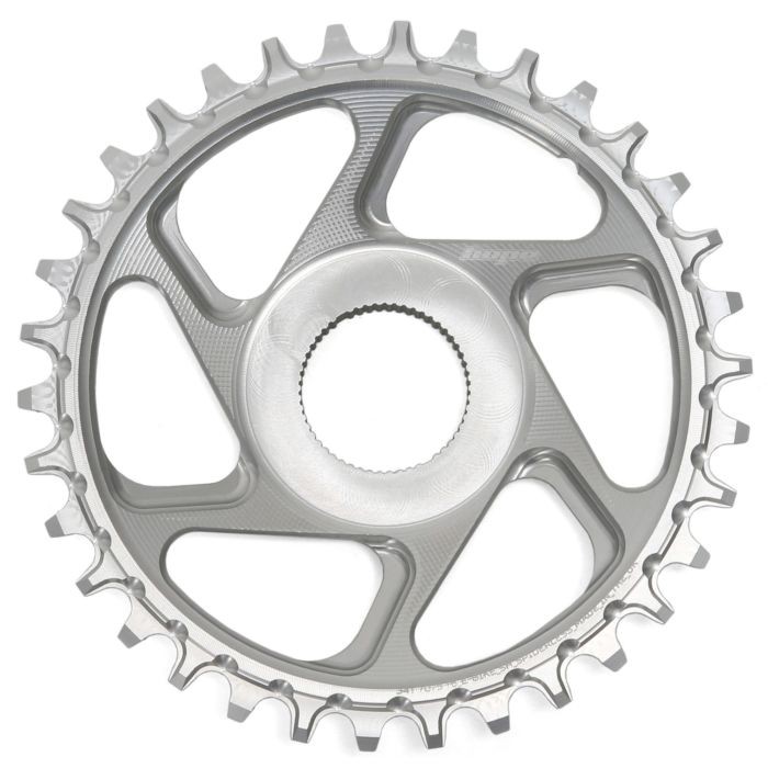 Silver Shimano direct mount chainring with 34 teeth, featuring a sleek design and cutouts for weight reduction, made from durable aluminum material.