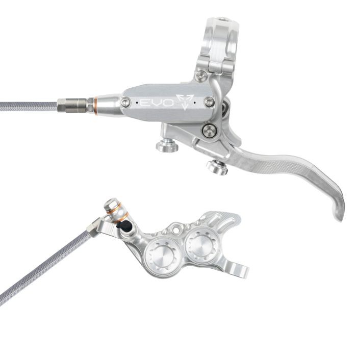 Silver hydraulic disc brake with a braided hose, featuring a sleek lever and a dual-piston caliper, designed for left-hand rear installation by Hope Tech.