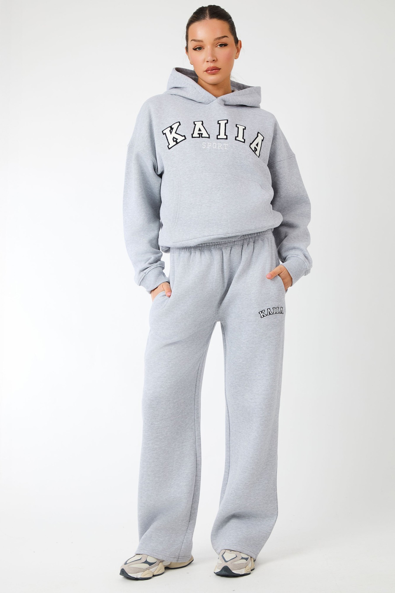 Grey marl wide leg joggers featuring an elastic waistband, side pockets, and "KAIIA" logo detailing in white, made from soft, comfortable material.