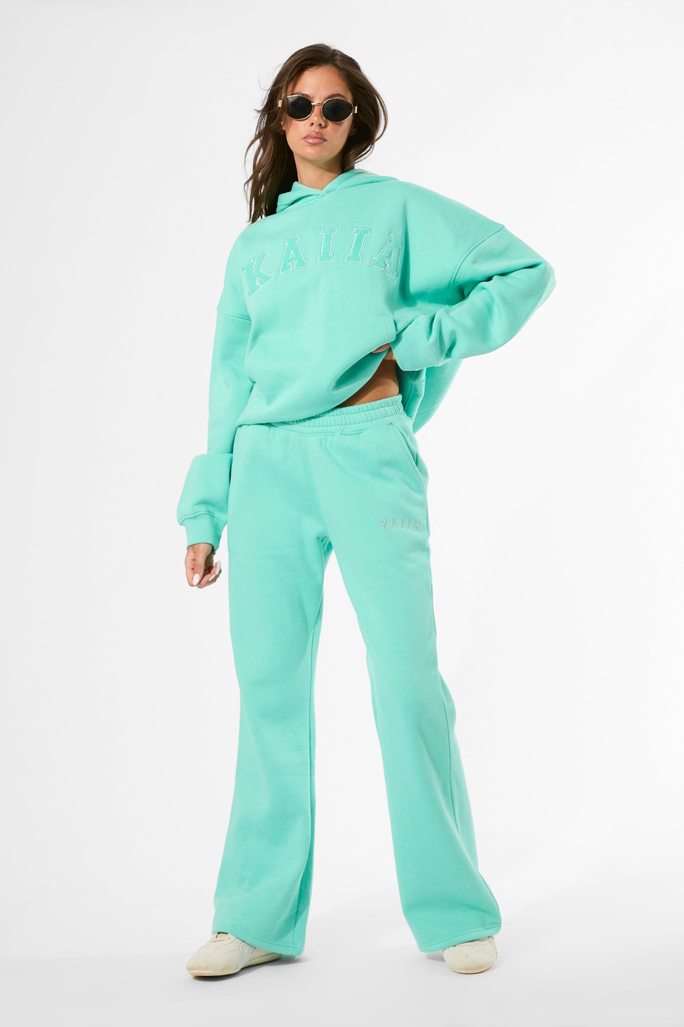 Spearmint wide-leg joggers by Kaiia, featuring a relaxed fit, soft material, and subtle logo detail, paired with a matching hoodie for a coordinated look.