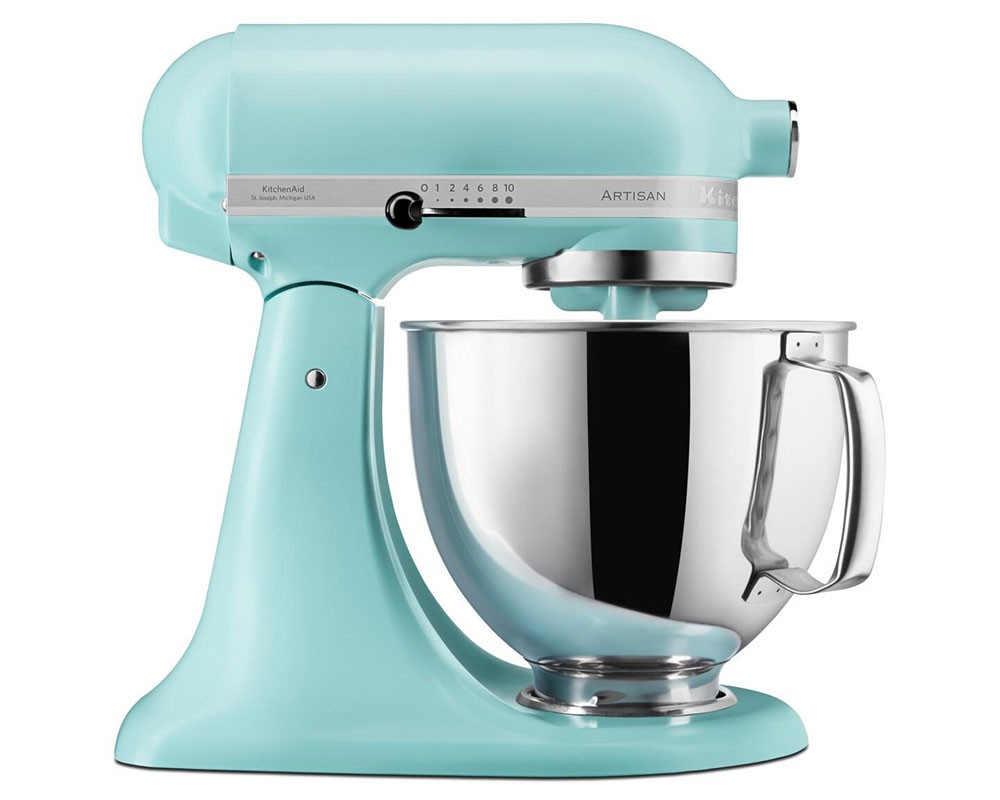 KitchenAid Artisan 5KSM125BMI stand mixer in a soft mineral water blue finish, featuring a stainless steel bowl, tilt-head design, and control dial for mixing speed adjustments.