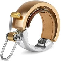 Brass Knog Oi Luxe Bell with sleek circular design, leather trim, and silver mounting bracket.