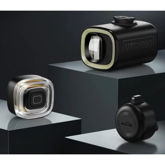 Black and transparent compact bike lights, featuring the VTG1000 with a rectangular design and the VTG50TL with a square shape, both showcasing sleek, modern aesthetics.