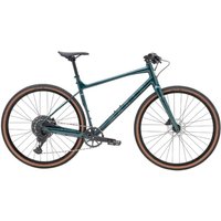 Teal Marin DSX 1 hybrid bike with flat handlebars, disc brakes, and brown-rimmed tires.