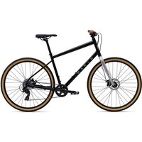 Black Marin Kentfield 1 hybrid bike with tan tires, flat handlebars, and silver front fork.