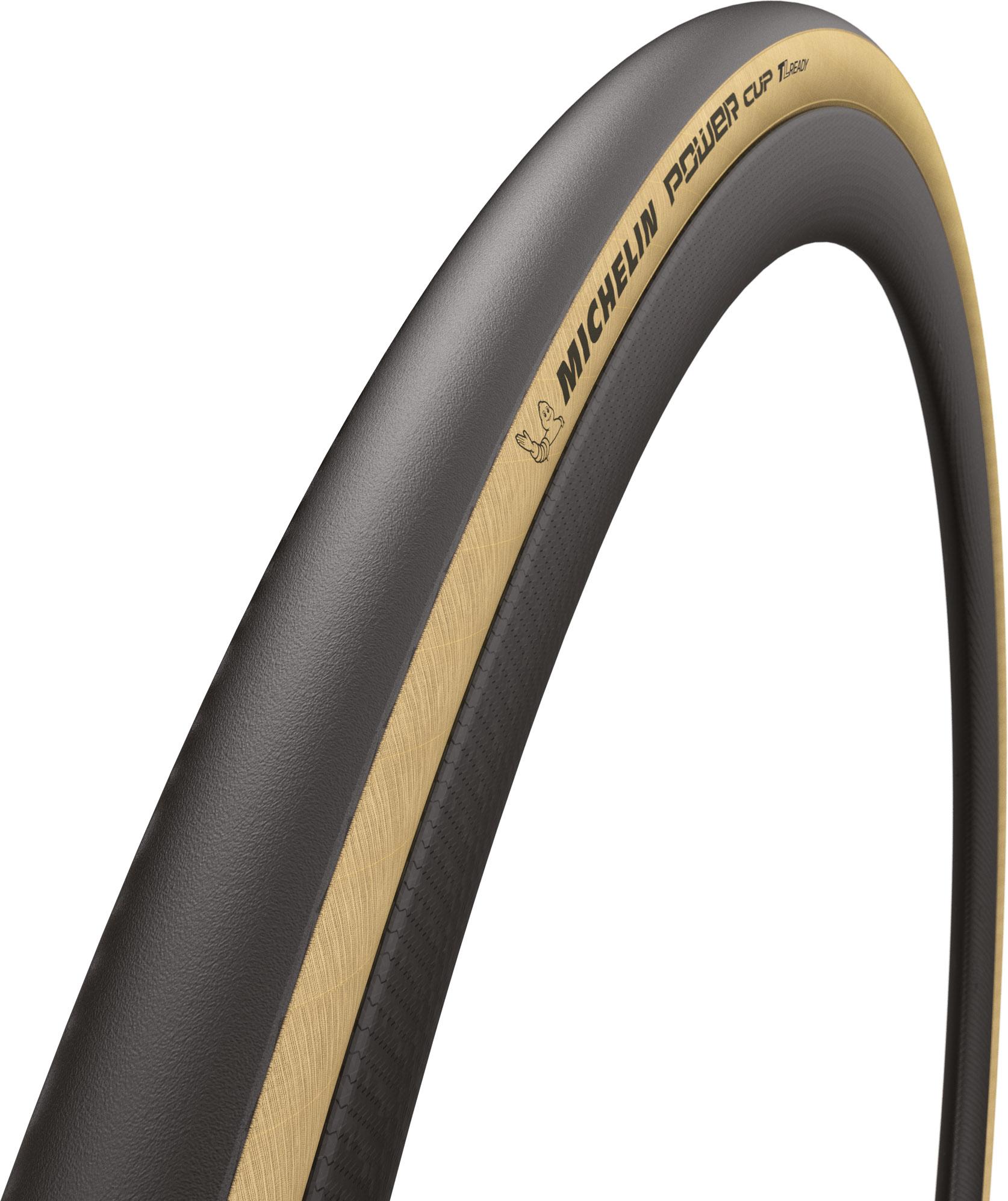 Black and tan Michelin Power Cup TLR tyre, size 700 x 28, featuring a smooth tread and a distinctive gold stripe along the sidewall, designed for high performance.
