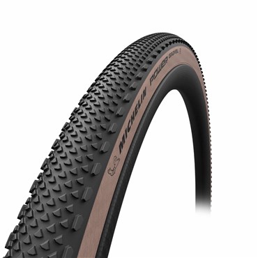 Black gravel tire with a textured surface and bronze sidewall, labeled "MICHELIN POWER" and featuring a 700x47C size, designed for enhanced grip and durability.