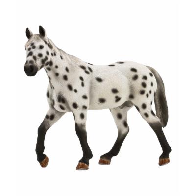 Leopard Appaloosa stallion figurine with a white body covered in black spots, detailed mane and tail, and brown hooves, crafted from durable plastic.