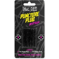 Muc-Off Puncture Plugs Refill Pack with black plugs in a black and pink blister packaging.