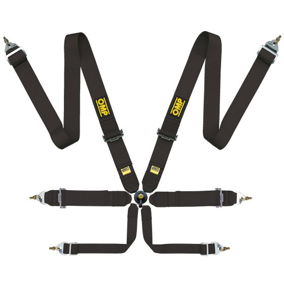 Black FIA racing harness with yellow OMP branding, featuring four adjustable straps and metal buckle connectors for secure fastening.