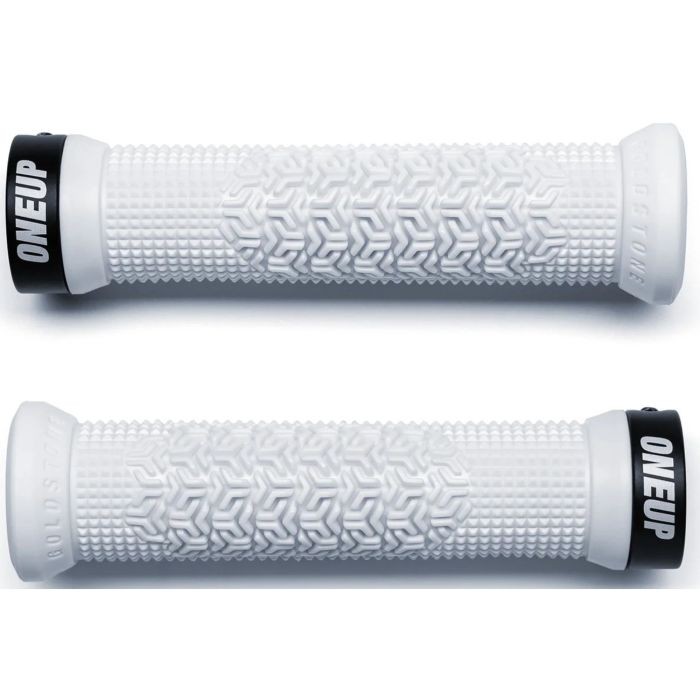 White rubber bike grips featuring a textured hexagonal pattern, with black end caps labeled "ONEUP" and "GOLDSTONE."