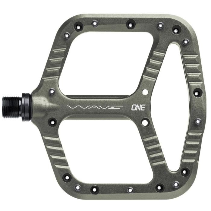 Gray aluminum OneUp Components Wave Pedal featuring a large platform, textured grip surface, and a distinctive wave design with cutouts for weight reduction.