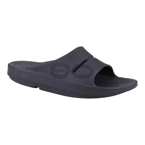 Matte black unisex slide sandal with a flexible design, featuring a wide strap and textured footbed for comfort, ideal for recovery and casual wear.