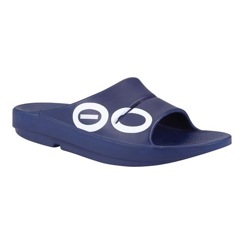 Navy unisex slide sandal featuring a wide strap with circular logo cutouts, made from a lightweight, cushioned material for comfort and support.