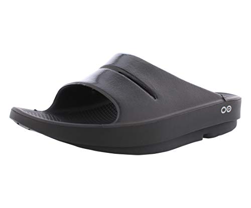 Black OOFOS Ooahh Recovery Sandals with a sleek design, featuring a wide strap and a textured footbed for comfort and support, ideal for post-activity recovery.
