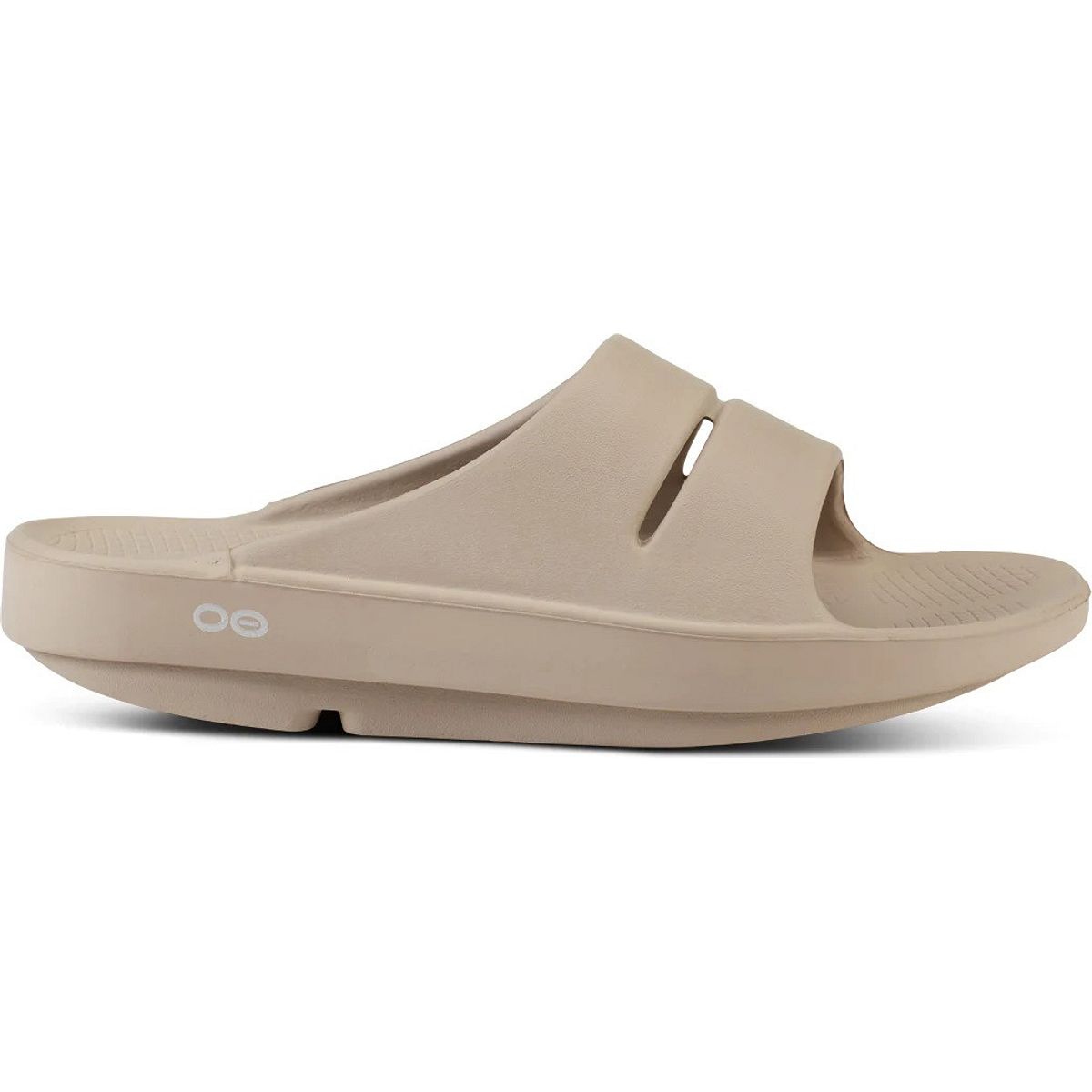Beige OOFOS Ooahh Slide Sandals featuring a sleek design with two cut-out straps, made from soft, durable foam material for comfort and support.