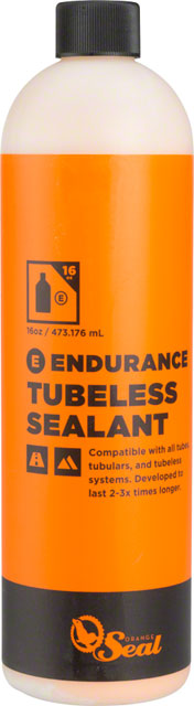 Orange Seal Endurance Sealant Refill in a 16oz bottle, featuring a bright orange label with black text, designed for tubeless systems, highlighting compatibility and longevity.