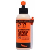 Orange bottle of Endurance Tubeless Sealant with black cap and injector system, by Orange Seal.