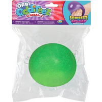Green Orb Odditeez Ultra Ball in clear packaging, featuring a smooth, round surface with a sparkling texture.