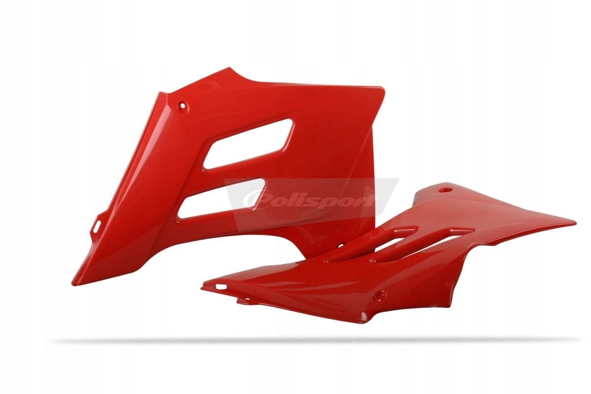 Red plastic radiator scoops designed for Gas Gas EC 250/450 models from 2005-2006, featuring sleek lines and ventilation slots for improved airflow.