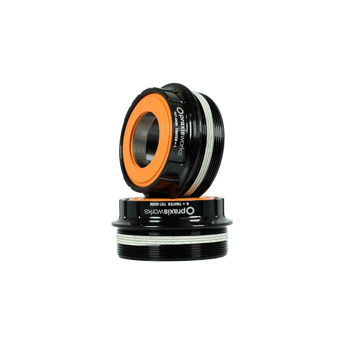 Black Praxis BB CONV Shimano bottom bracket with 24mm spindle, T47 threading, and orange sealing ring, designed for 68/73mm shell widths.