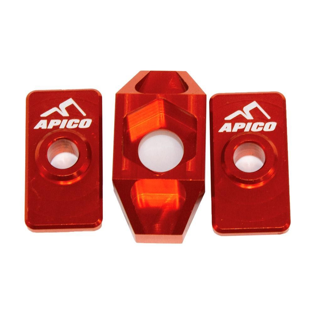 Bright orange anodized aluminum rear axle blocks with the Apico logo, designed for KTM SX50 (2009-2019) and Husqvarna TC50 (2017-2019) models.