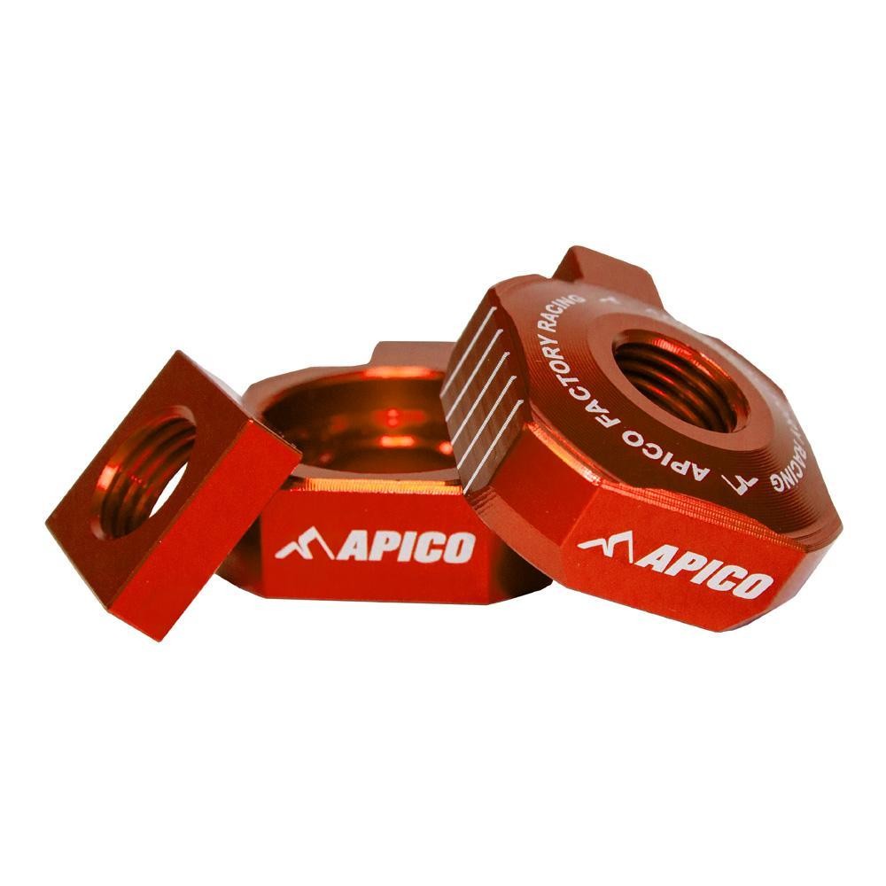 Orange anodized aluminum rear axle blocks with "APICO" branding, designed for KTM SX65, Husqvarna TC65, and Gas Gas MC65 models from specific years.