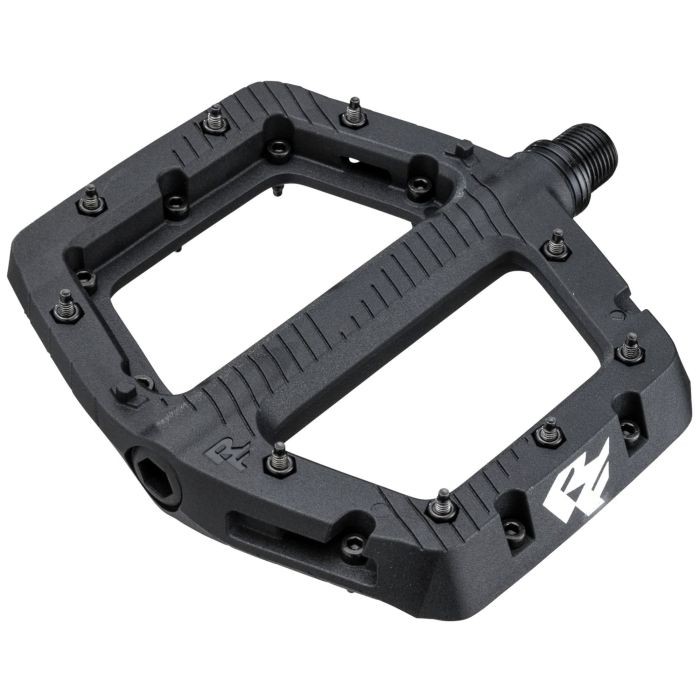Black Race Face Chester pedals featuring a durable composite material, a wide platform, and multiple grip pins for enhanced traction.