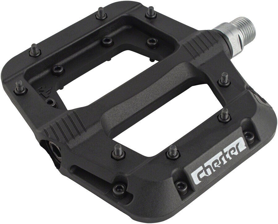 Black Race Face Chester pedals with a large platform, made of durable plastic, featuring textured grip pins and a visible threaded axle for easy installation.
