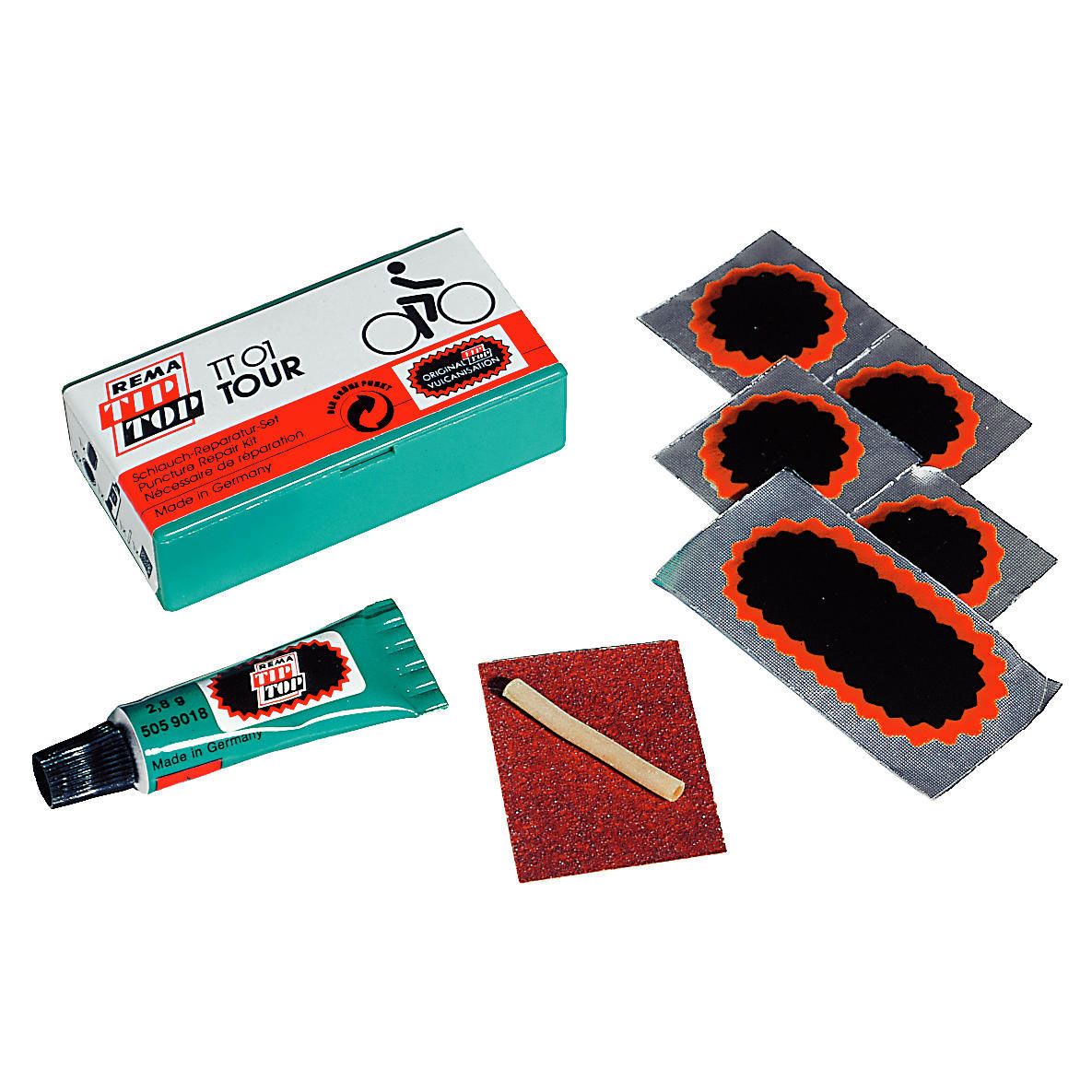 Rema TT02 Standard Patch Kit includes a green and white box with a bicycle graphic, four round black patches with orange borders, a tube of adhesive, and a wooden applicator stick.