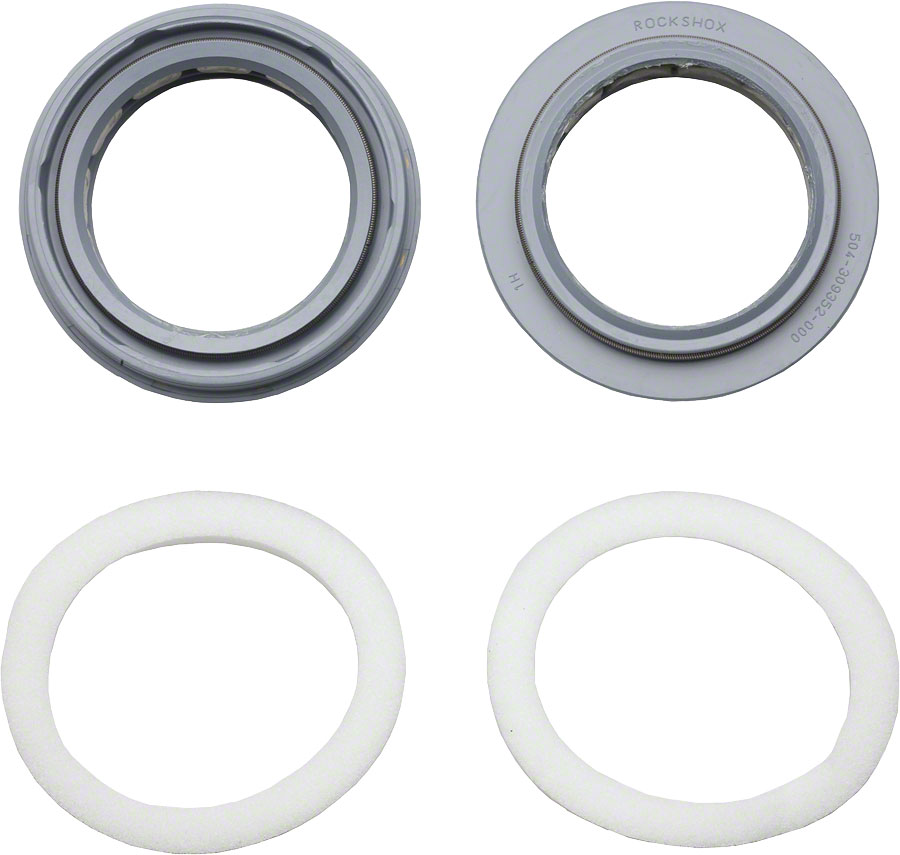 RockShox Dust Seal Foam Ring Kit featuring two grey plastic dust seals and two white foam rings, designed for mountain bike suspension maintenance.