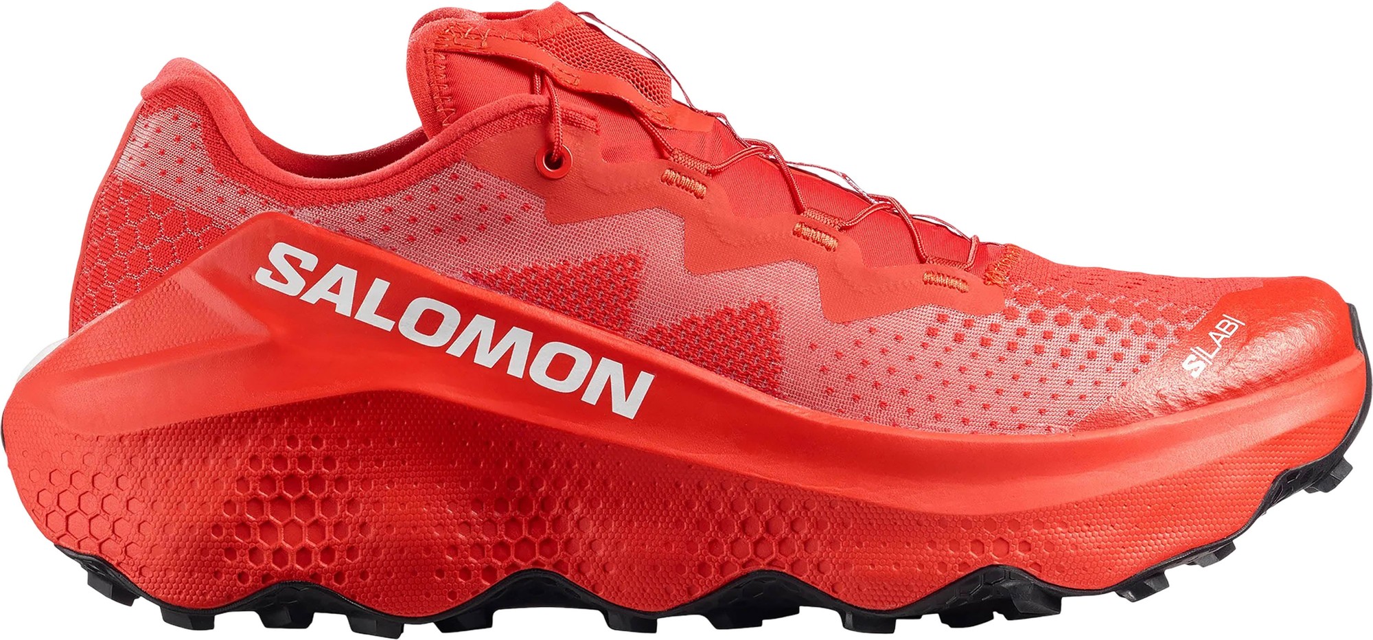 Bright fiery red Salomon S/Lab Ultra Glide 1.5 unisex running shoe featuring a breathable mesh upper, prominent zigzag design, and rugged black outsole, size 9.5.