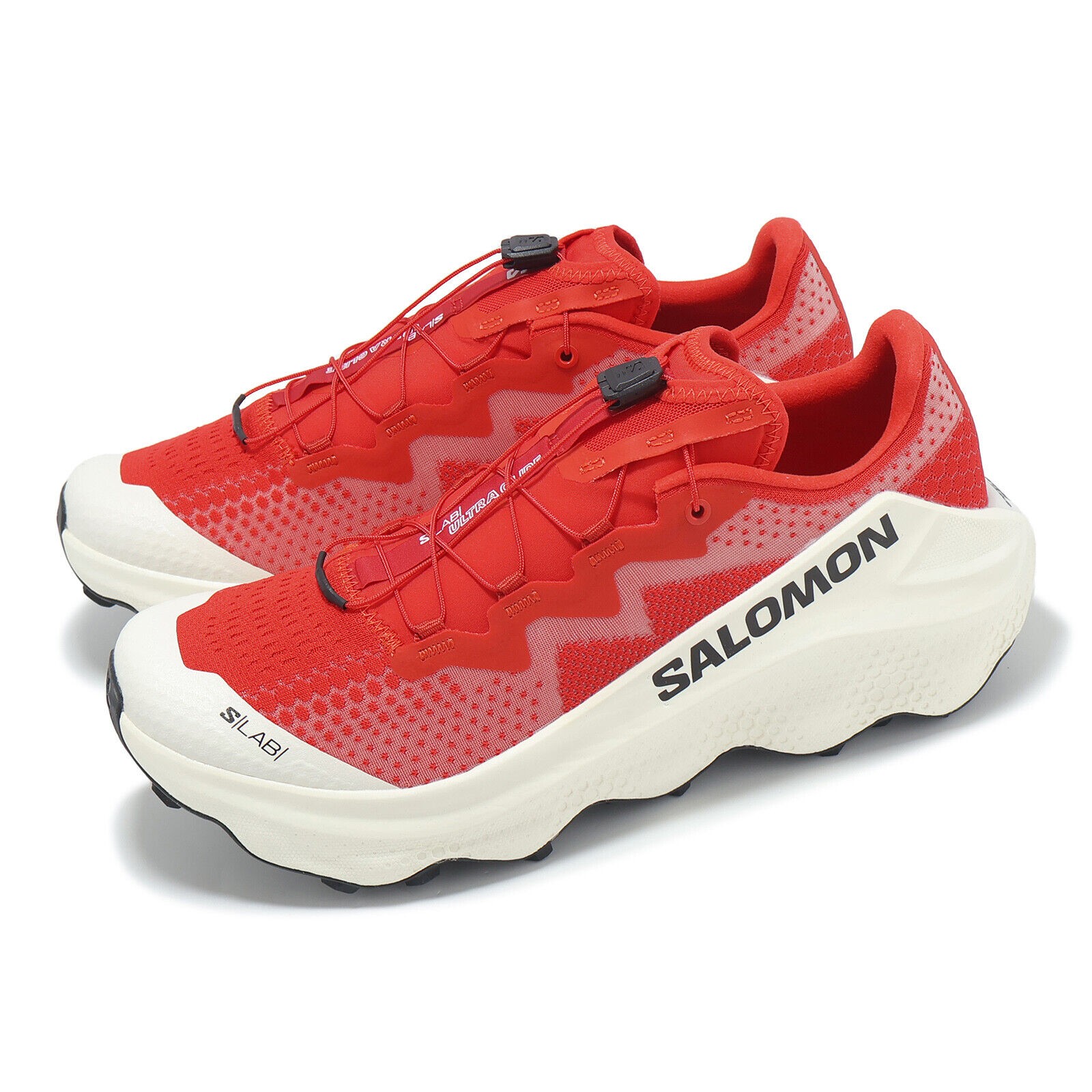 Bright red Salomon S/Lab Ultra Glide shoes with a mesh upper, contrasting white sole, and black branding, featuring a secure lacing system, size 10.5.