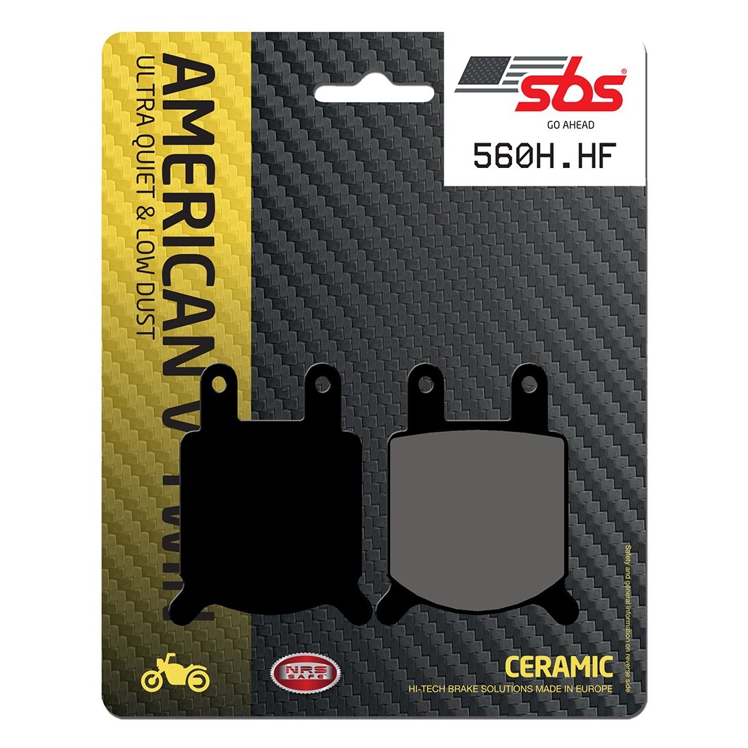 Black and gray brake pads packaged on a card, featuring "SBS" branding, "560HF" model number, and "Ultra Quiet & Low Dust" text, with a textured carbon fiber background.