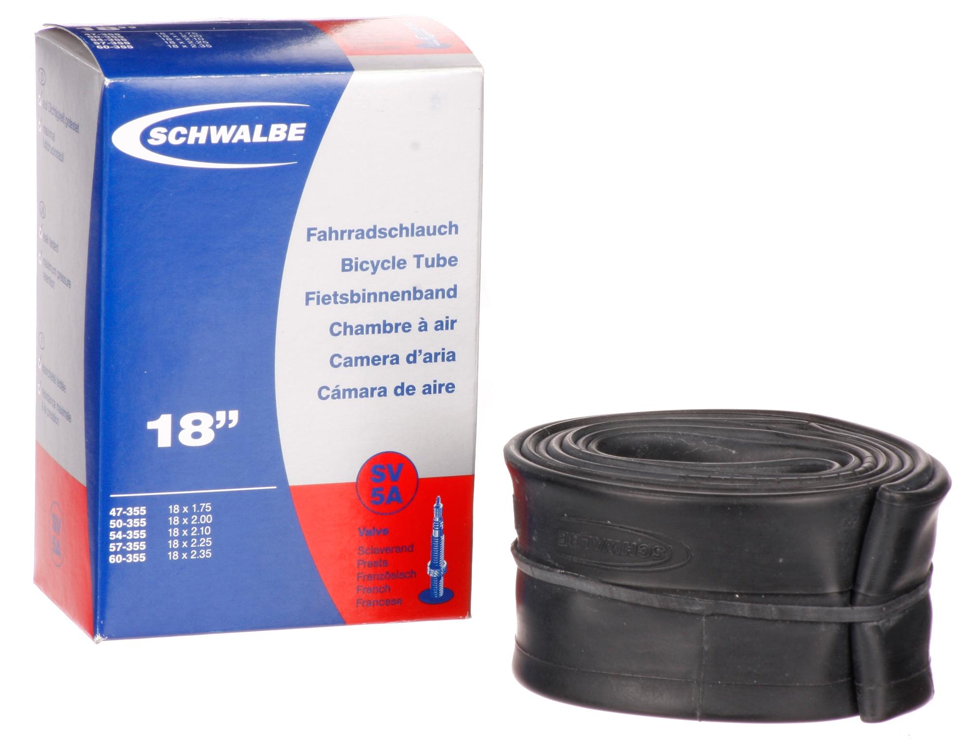 Black Schwalbe bike inner tube, 26 inch x 1.5-2.5 inch, with Presta valve, next to blue and red packaging box.