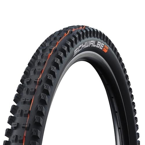 Schwalbe Tacky Chan Radial Bicycle Tire featuring a black rubber surface with prominent, aggressive tread patterns and orange accents, designed for downhill and enduro mountain biking.