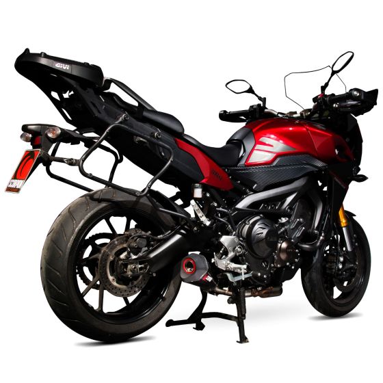 Scorpion Serket Taper Silencer features a sleek carbon sleeve, designed for road legality, mounted on a red motorcycle with a sporty profile and a black seat.