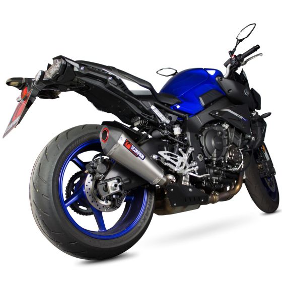 Satin titanium exhaust silencer with a sleek design, featuring a red end cap, mounted on a blue motorcycle with a sporty rear profile and visible brake components.