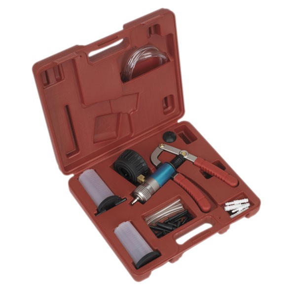 Red plastic case containing a vacuum and pressure test/bleed kit, featuring a blue and silver pump, clear hoses, and various black adapters.