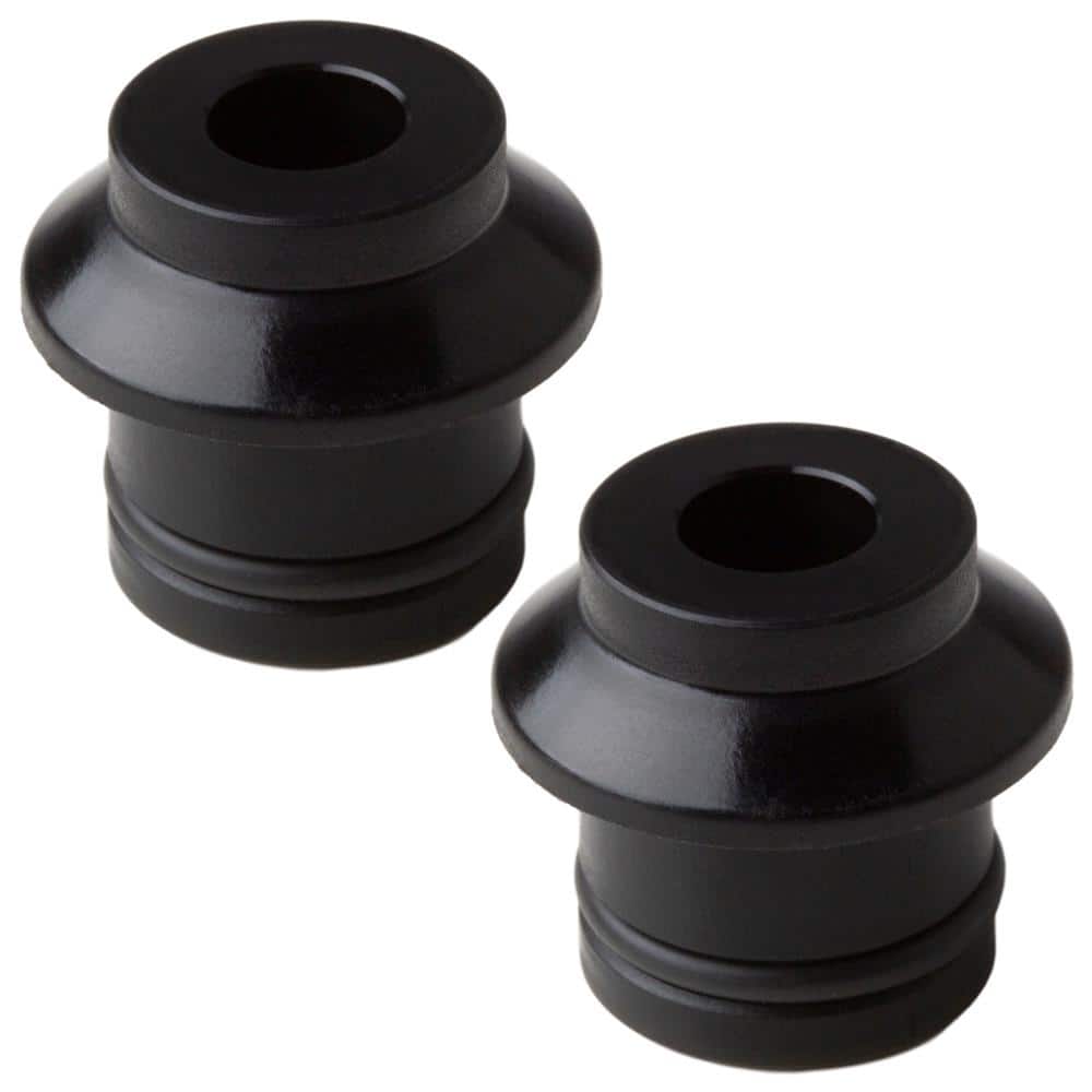 Black plastic HUSKE plugs by SeaSucker, featuring a smooth, rounded design with a central hole and ribbed base for secure fitting, ideal for bike racks or accessories.