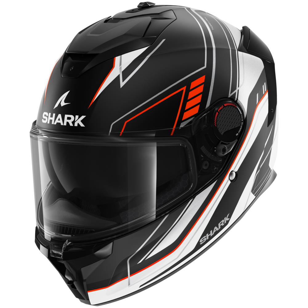 Shark Spartan GT Pro Carbon motorcycle helmet in matte black with orange and silver accents, featuring a sleek design, a tinted visor, and ventilation controls.