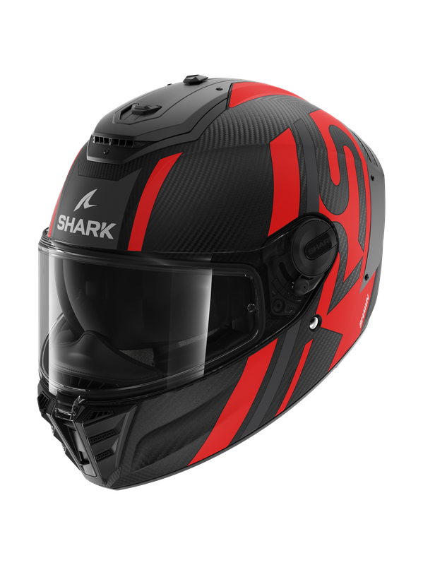Shark Spartan RS Carbon motorcycle helmet in matte carbon with anthracite and red accents, featuring a clear visor and aerodynamic design.