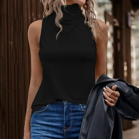 Black sleeveless top with a high neck, featuring a relaxed fit, paired with blue denim jeans and a black leather jacket, styled casually for an urban look.