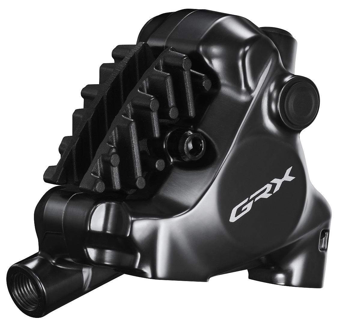 Black Shimano BR-RX820 GRX hydraulic disc brake caliper featuring a sleek design, prominent GRX logo, and a distinctive ribbed surface for enhanced grip and performance.