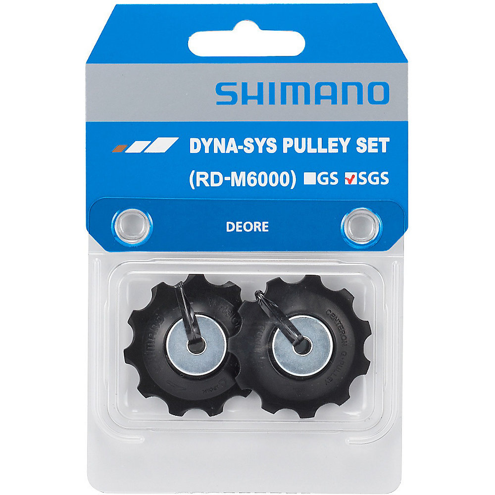 Black Shimano Deore RD-M6000 tension and guide pulley set, featuring silver center bearings, packaged in a clear plastic blister with a blue and white Shimano branding card.