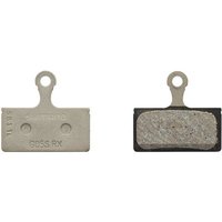 Shimano G05S-RX disc pads with metal backing and textured braking surface, includes small metal spring.